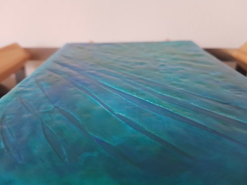 Side view of blue green abstract painting