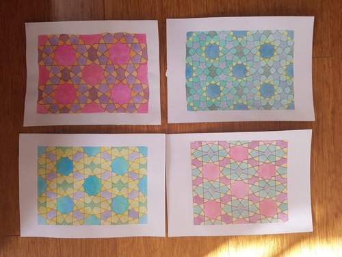 Four examples of pentagonal designs painted in acrylic