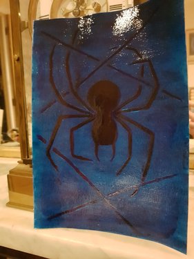 Final version on a mantlepeice of a red blue spider