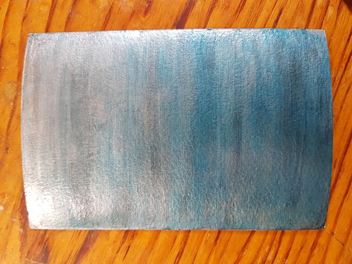First silver blue and black item